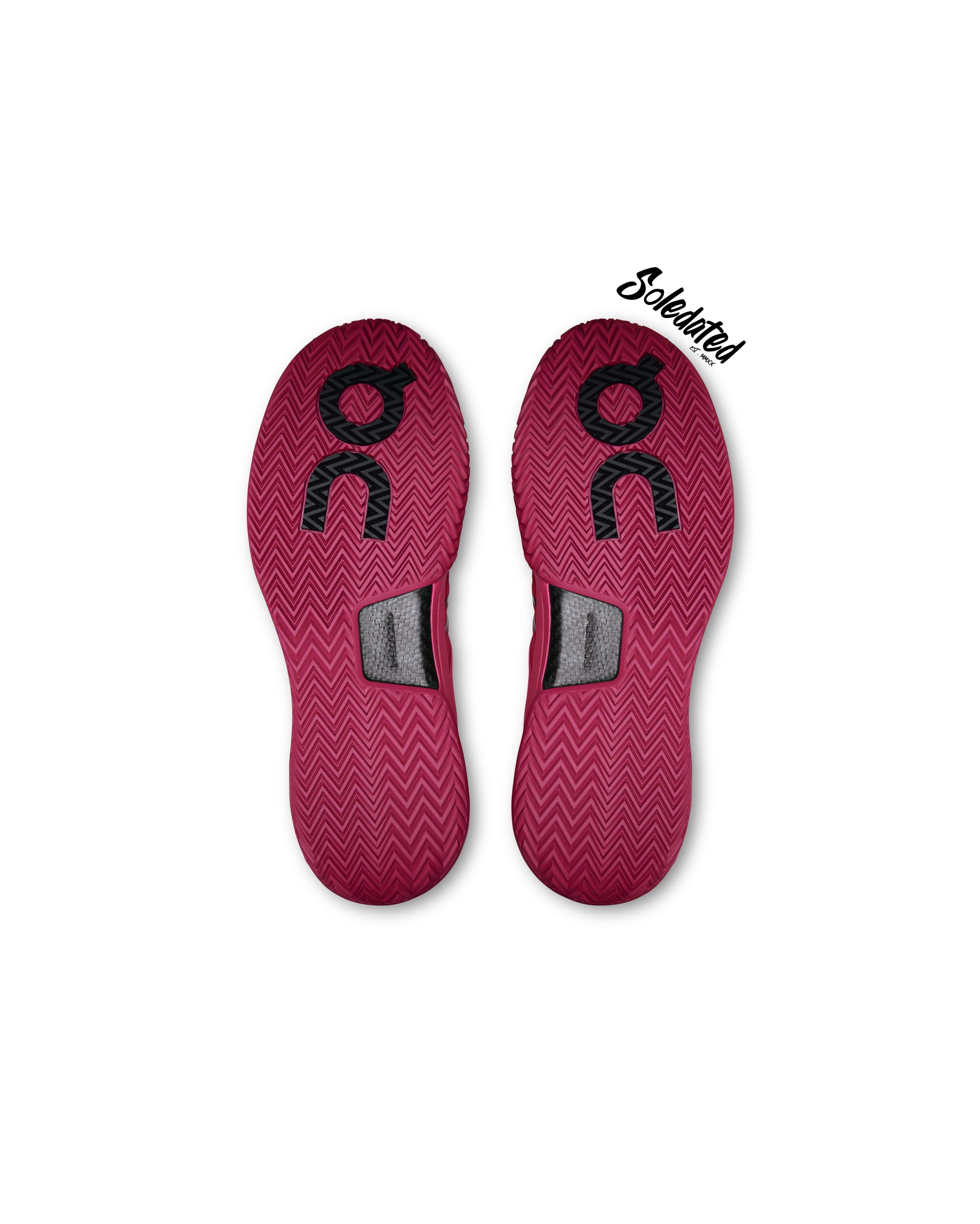 Outsole view of On THE ROGER Pro 2 Pink Grenadine showing open herringbone traction and Speedboard