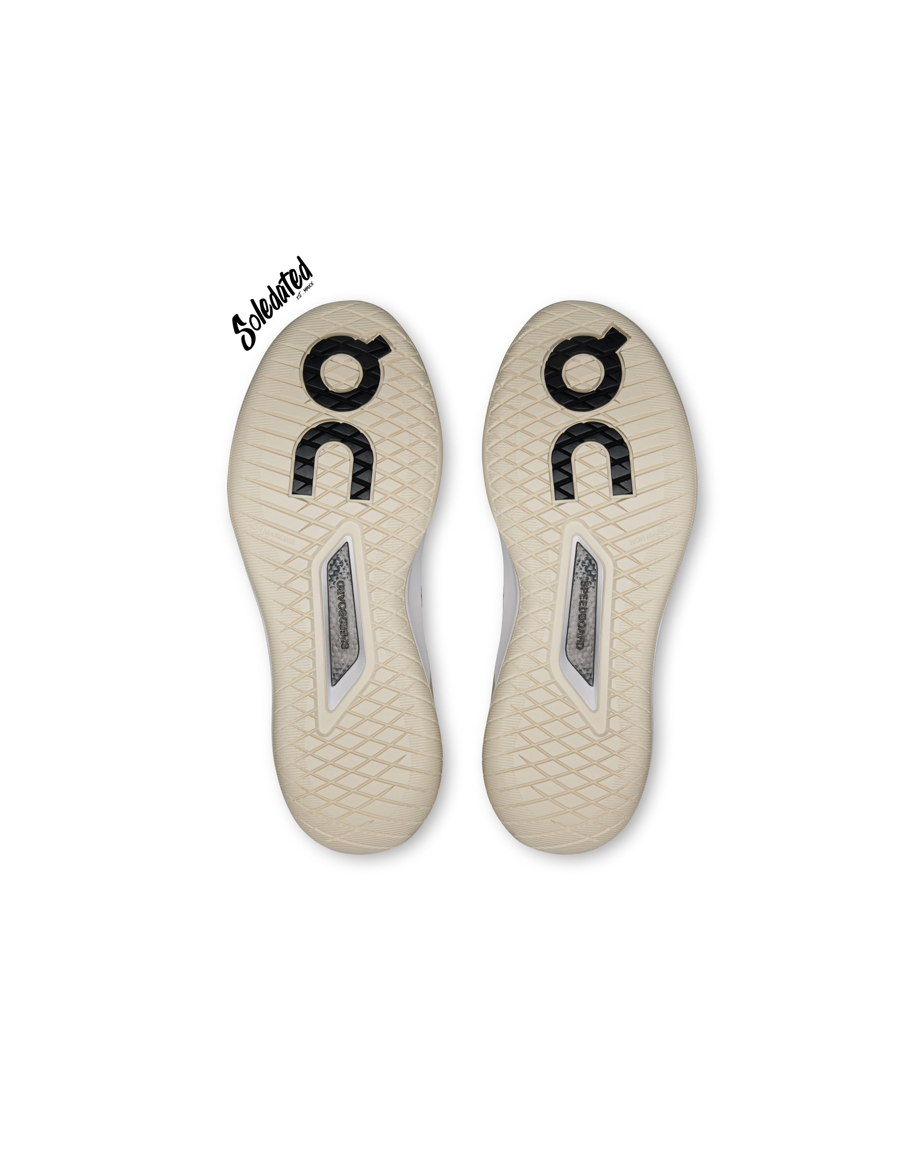 Outsole view of On THE ROGER Pro 3 Ivory Wash showing diamond traction pattern and Speedboard